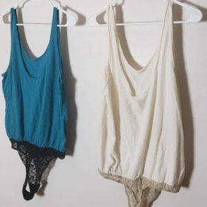 Two Loose Free People Tank Bodysuits